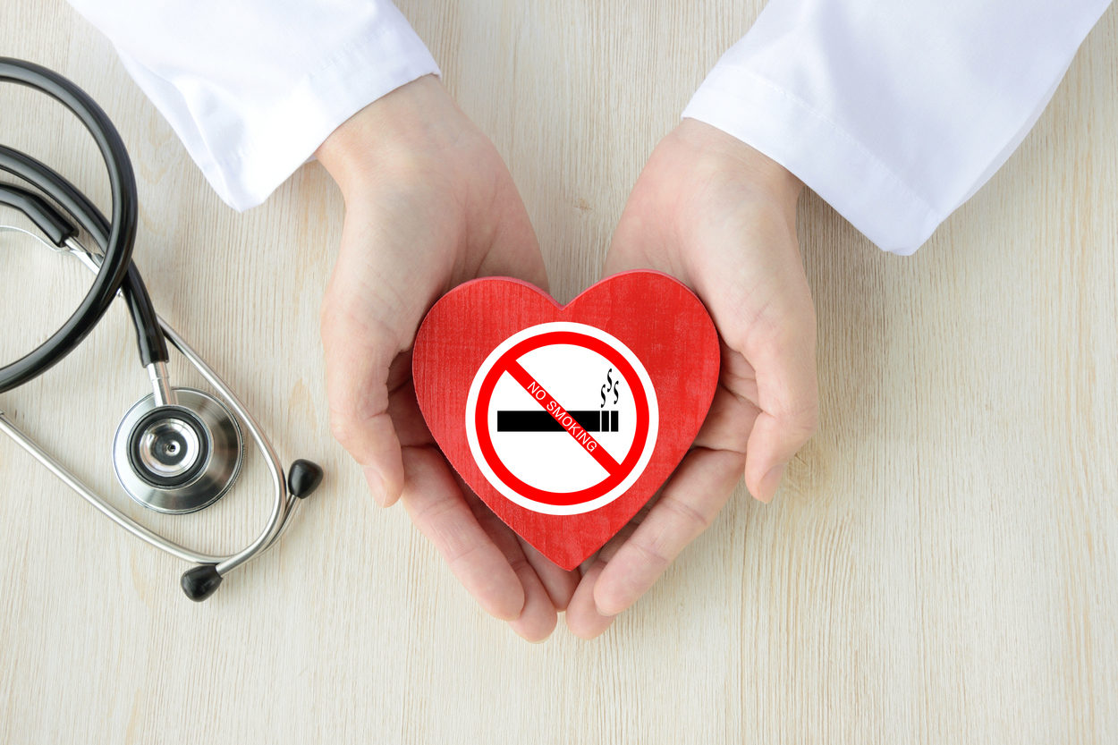 Doctor having heart object with no smoking sticker